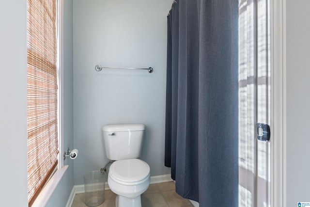 bathroom with tile patterned flooring and toilet