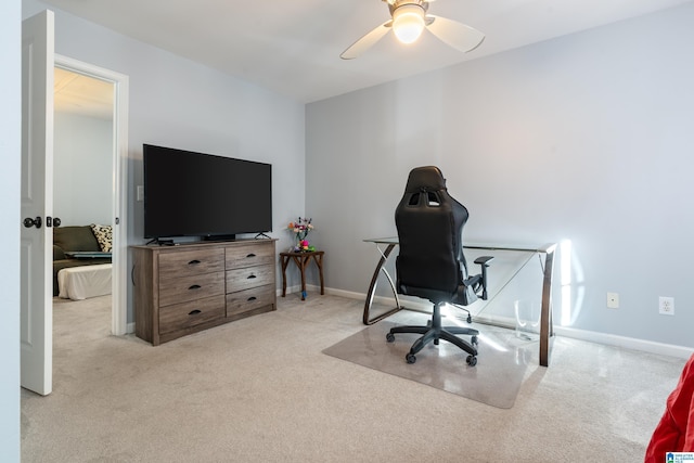 home office featuring ceiling fan and light colored carpet