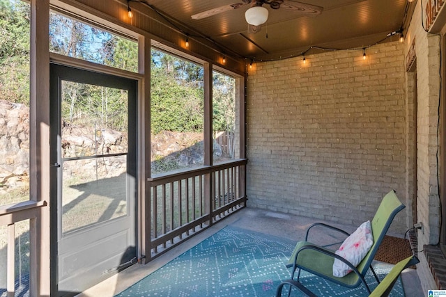 sunroom featuring plenty of natural light and ceiling fan