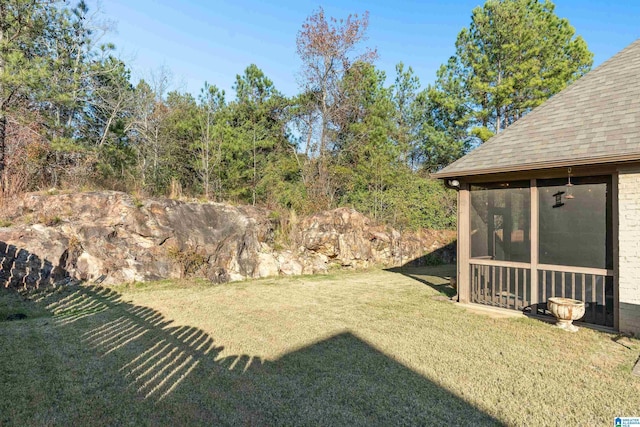 view of yard with a sunroom