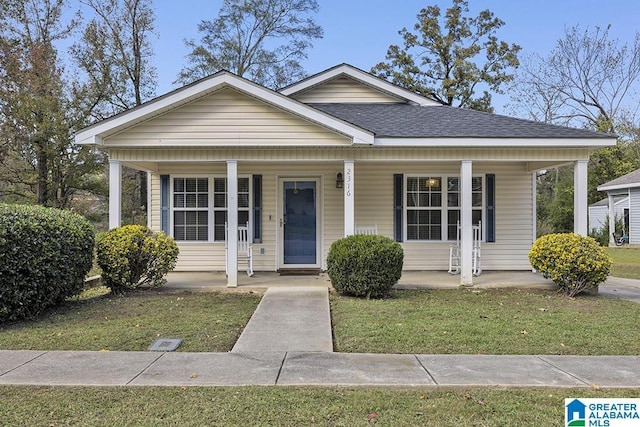 bungalow-style home with a front yard and a porch