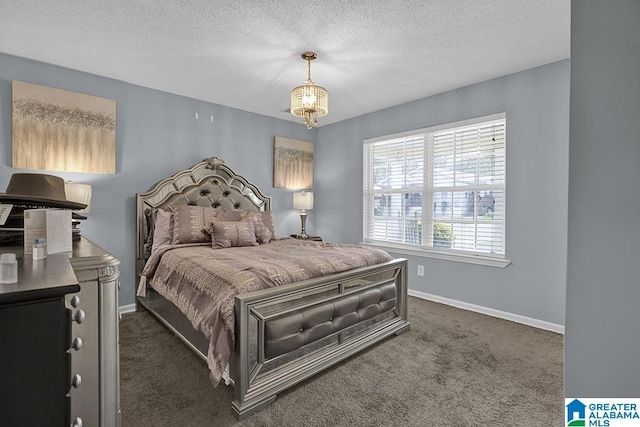 carpeted bedroom featuring a textured ceiling and a notable chandelier