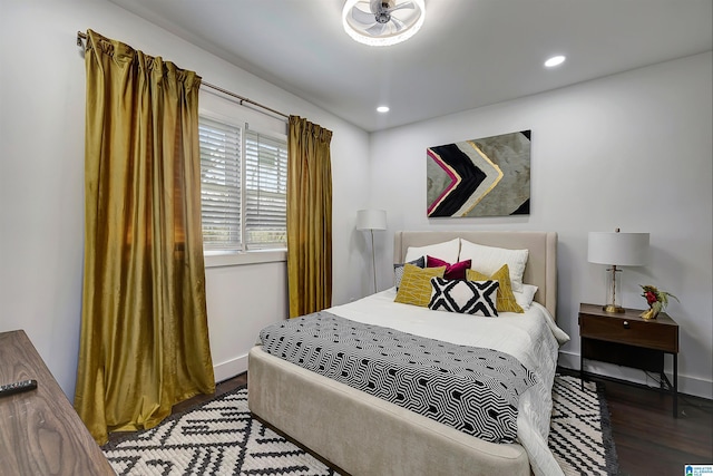 bedroom featuring dark hardwood / wood-style flooring