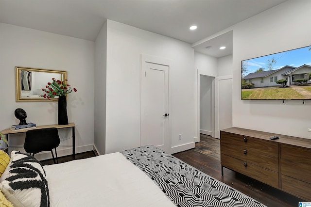 bedroom with dark wood-type flooring