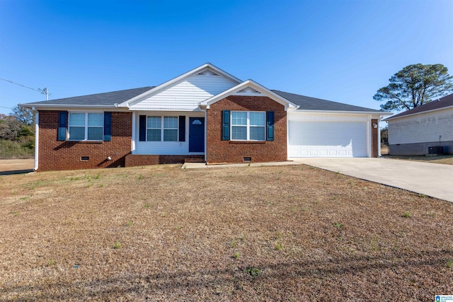 ranch-style house with a garage, a front lawn, and central air condition unit