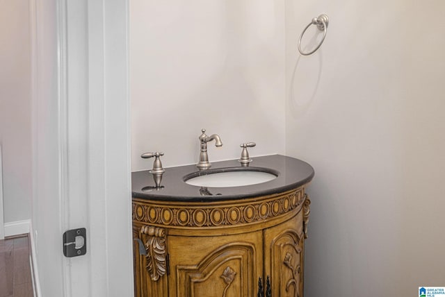 bathroom with hardwood / wood-style floors and vanity