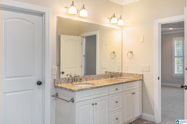 bathroom with vanity and ornamental molding