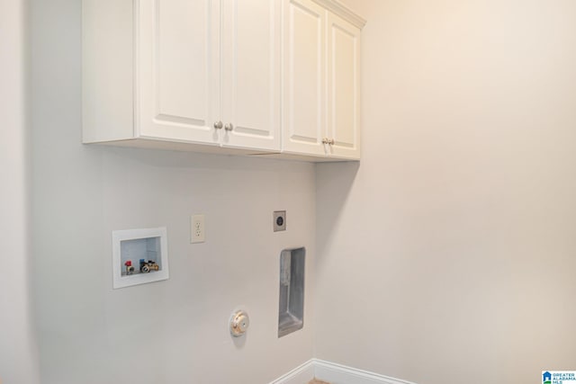 washroom featuring hookup for an electric dryer, cabinets, hookup for a gas dryer, and washer hookup