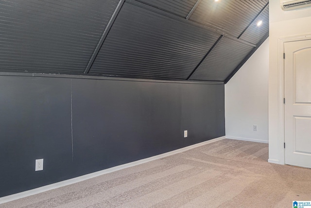 additional living space with carpet flooring, lofted ceiling, and an AC wall unit