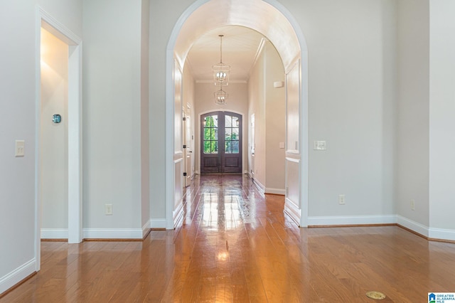 foyer with light hardwood / wood-style flooring and french doors