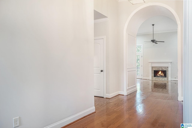 hallway featuring light hardwood / wood-style flooring and ornamental molding