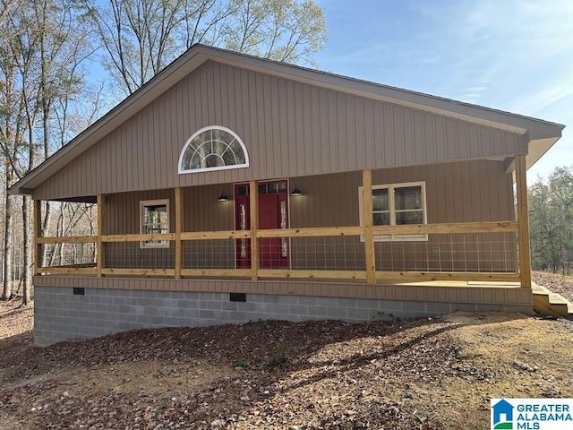 view of property exterior featuring covered porch