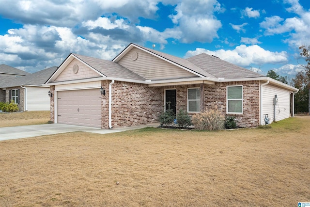 view of front of property featuring a garage and a front yard