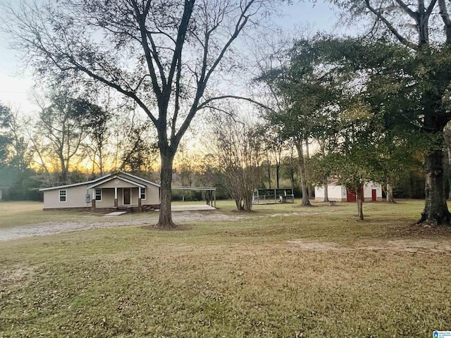 yard at dusk with a carport