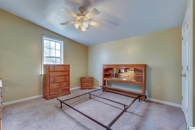 living area with ceiling fan and light colored carpet