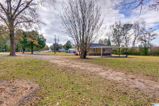 view of yard with a carport