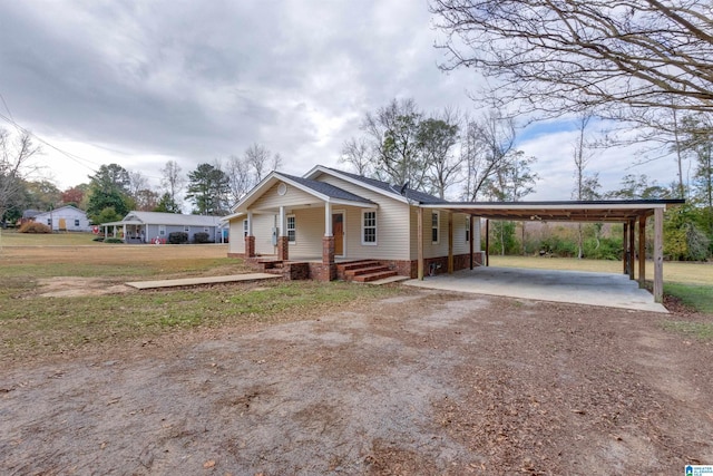 view of front of property featuring a carport and a porch