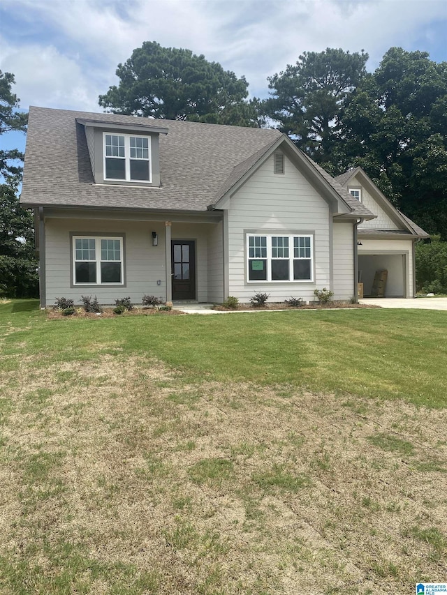 craftsman-style home featuring a front yard and a garage