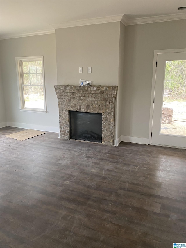 unfurnished living room featuring dark hardwood / wood-style floors and ornamental molding