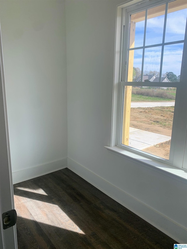 unfurnished room featuring hardwood / wood-style floors