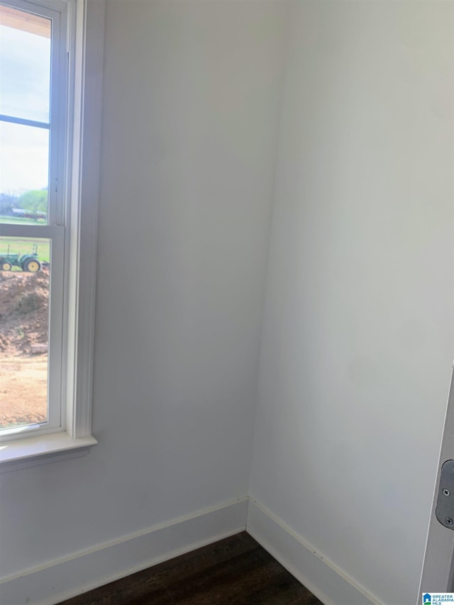 spare room featuring dark wood-type flooring