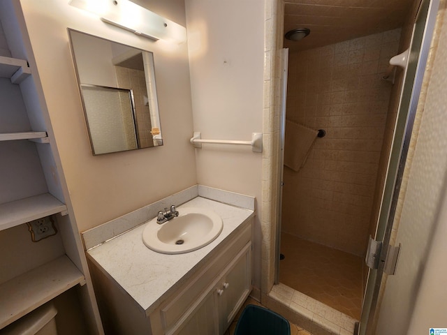 bathroom featuring vanity and an enclosed shower