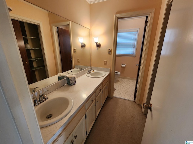 bathroom with tile patterned floors, vanity, and toilet