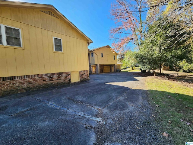 view of side of property with a garage