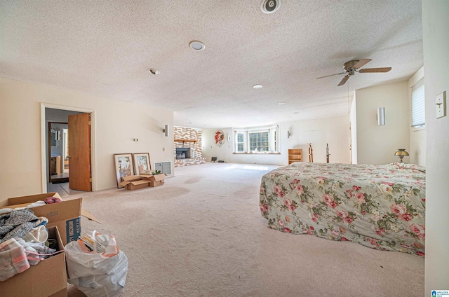 bedroom with light carpet, multiple windows, and ceiling fan