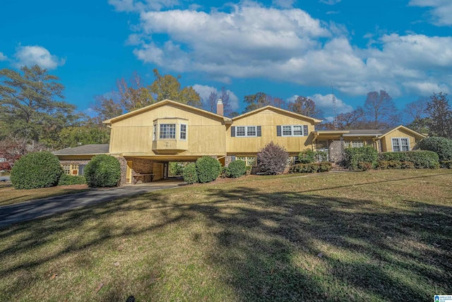 3501 Laurel View Ln, Hoover, AL 35216 - view of front of house featuring a carport, a front lawn, a chimney, and asphalt driveway