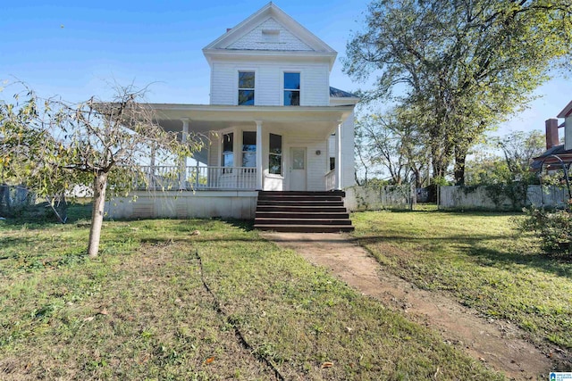 view of front of home with a porch and a front yard