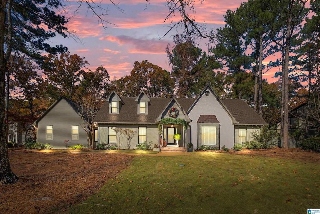 view of front of property with a yard