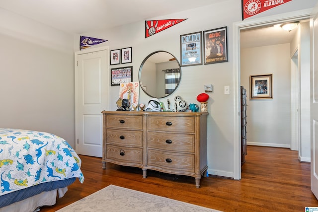 bedroom featuring dark hardwood / wood-style flooring