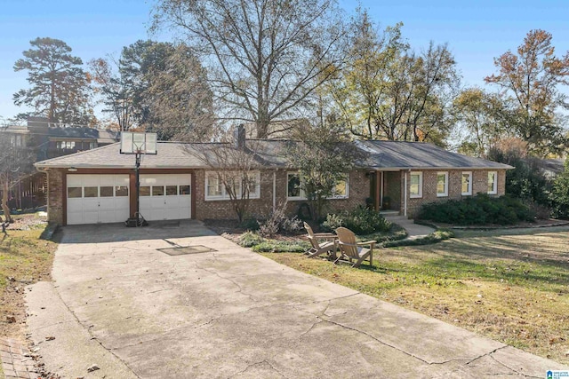 single story home featuring a garage and a front yard