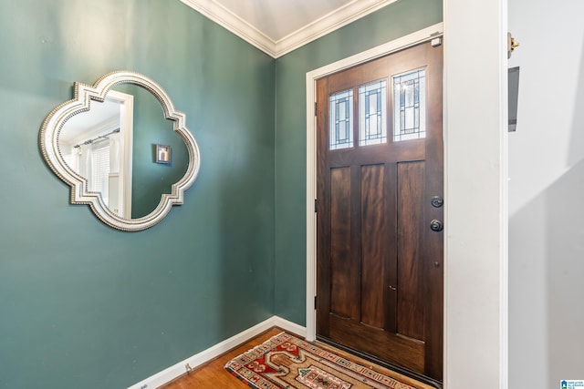 entryway with hardwood / wood-style flooring and crown molding