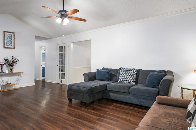 living room with lofted ceiling, dark wood-type flooring, ceiling fan, ornamental molding, and a textured ceiling