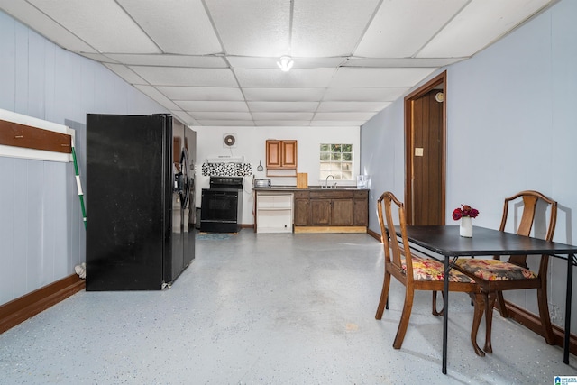 dining room with a drop ceiling and sink