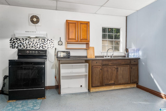 kitchen with black range with electric stovetop, sink, and a drop ceiling