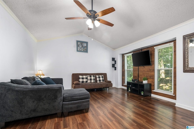 living room with vaulted ceiling, ceiling fan, ornamental molding, a textured ceiling, and dark hardwood / wood-style flooring