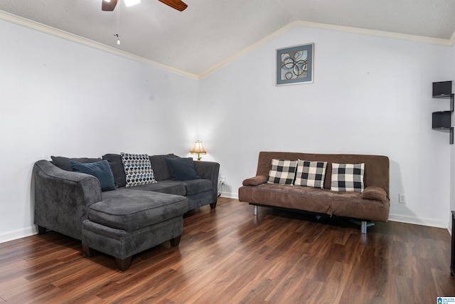 living room featuring ceiling fan, dark hardwood / wood-style flooring, a textured ceiling, vaulted ceiling, and ornamental molding