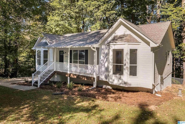 view of front of home with a front lawn and a porch