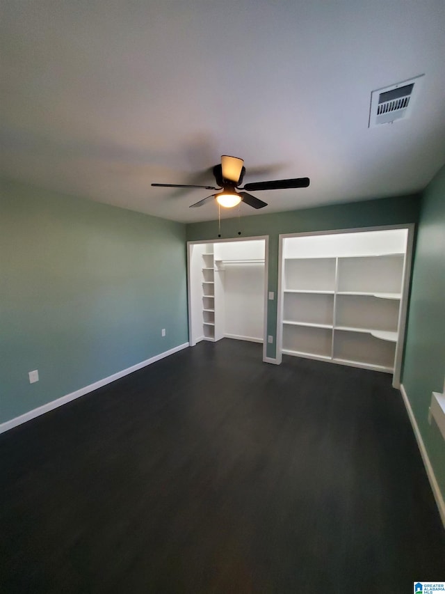 1245 16th St SW, Birmingham, AL 35211 - empty room featuring baseboards, dark wood-style floors, and a ceiling fan