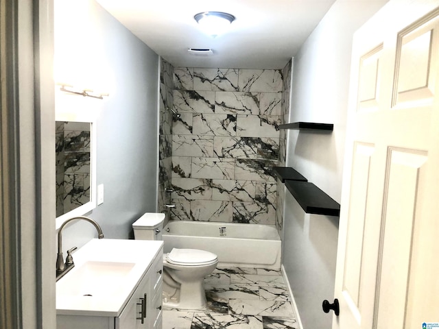 full bathroom featuring toilet, vanity, and tiled shower / bath