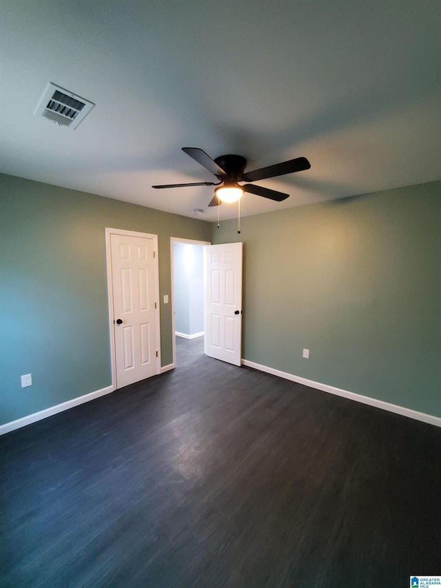1245 16th St SW, Birmingham, AL 35211 - empty room featuring baseboards, ceiling fan, and dark wood finished floors