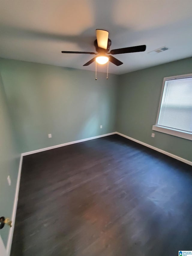 1245 16th St SW, Birmingham, AL 35211 - unfurnished room with a ceiling fan, baseboards, and dark wood finished floors