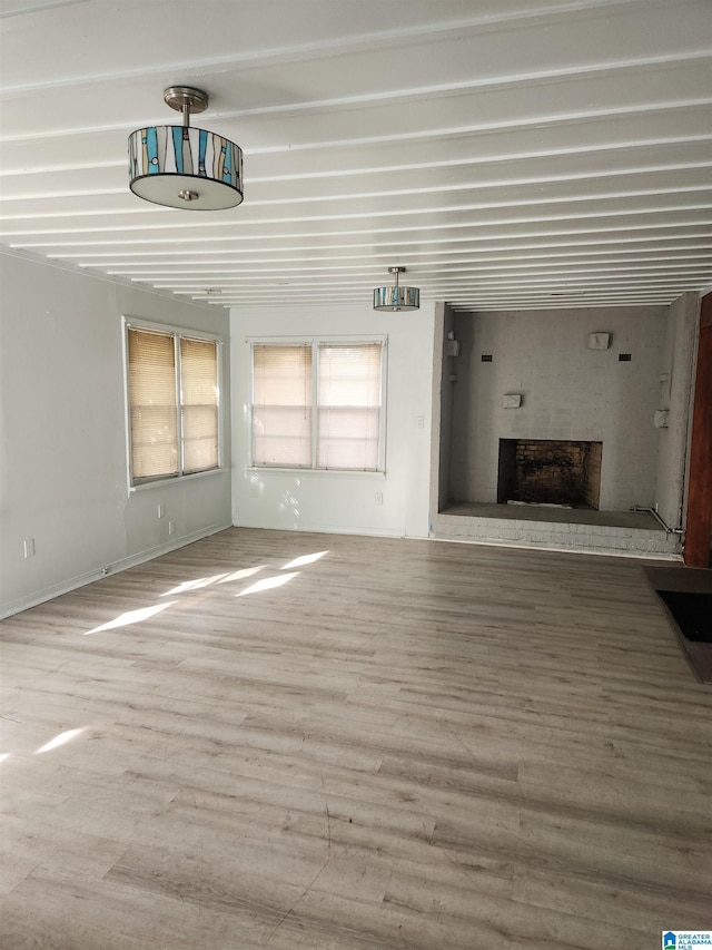 unfurnished living room with hardwood / wood-style floors