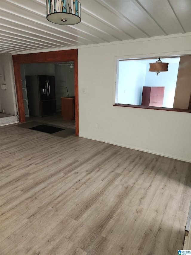 unfurnished living room featuring light wood-type flooring