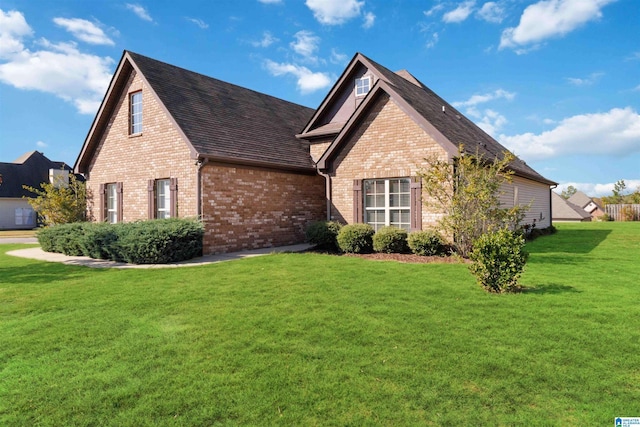 view of property exterior featuring a lawn