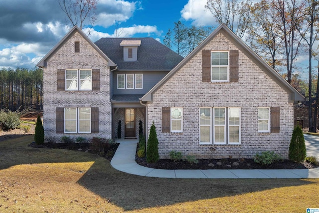 front facade with a front yard