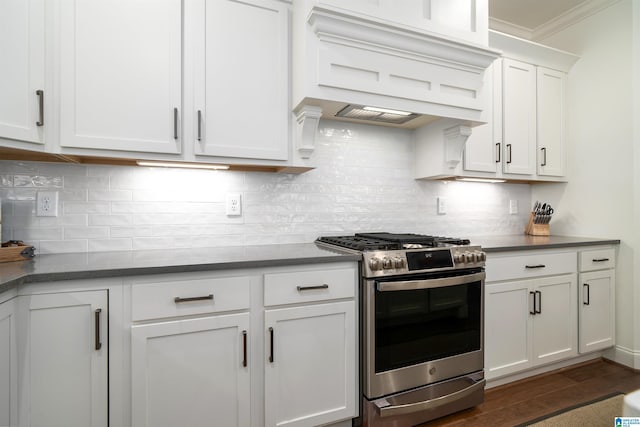 kitchen featuring custom exhaust hood, backsplash, dark wood-type flooring, white cabinets, and stainless steel gas stove